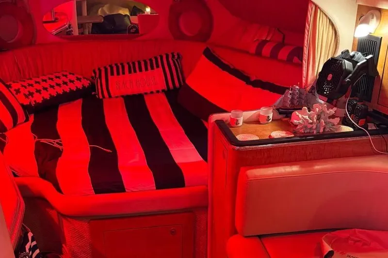 Slide: The Image of 2006 Sea Ray 290 Amberjack boat with covered cockpit, docked near residential area. - 17