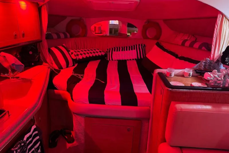 Slide: The Image of 2006 Sea Ray 290 Amberjack boat deck with hatch and railing. - 18