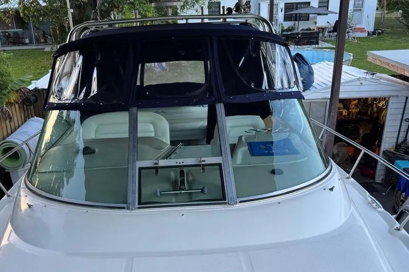 Slide: The Image of 2006 Sea Ray 290 Amberjack boat with blue cover and "Adventure" text. - 20