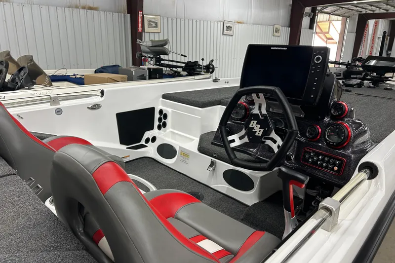 Slide: The Image of 2023 Bass Cat Eyra boat interior with modern dashboard and seating. - 4