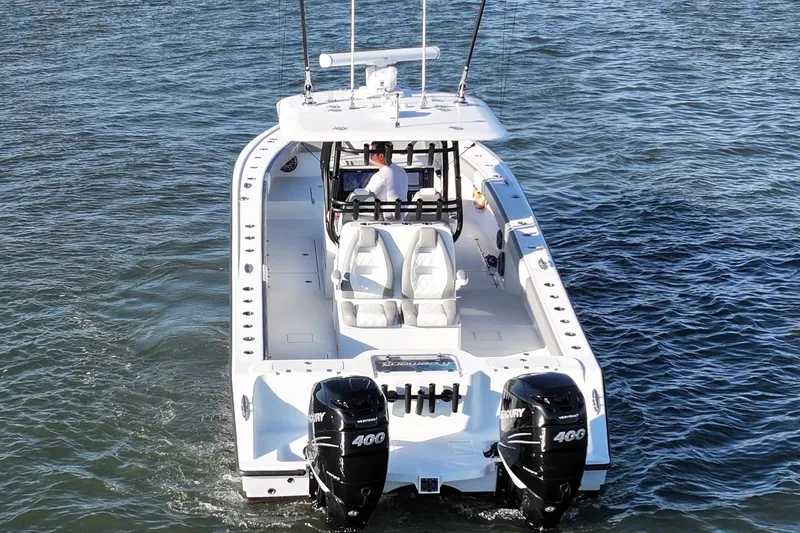 Slide: The Image of 2020 Freeman 34VH boat on water, featuring dual Mercury 400 engines. - 12