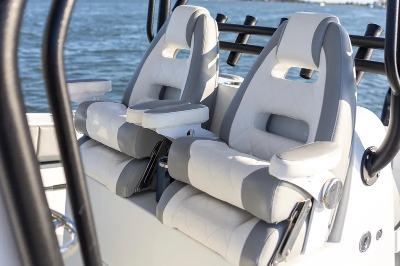 Slide: The Image of Luxury seating on a 2020 Freeman 34VH boat with ocean backdrop. - 17