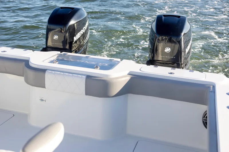 Slide: The Image of 2020 Freeman 34VH boat with dual Mercury outboard engines on water. - 19