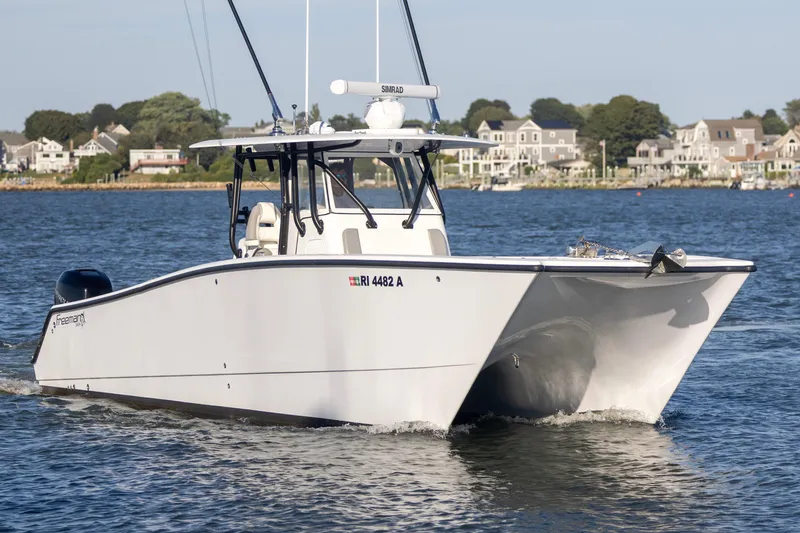 Slide: The Image of Freeman 34VH 2020 boat cruising on water near coastal homes. - 7