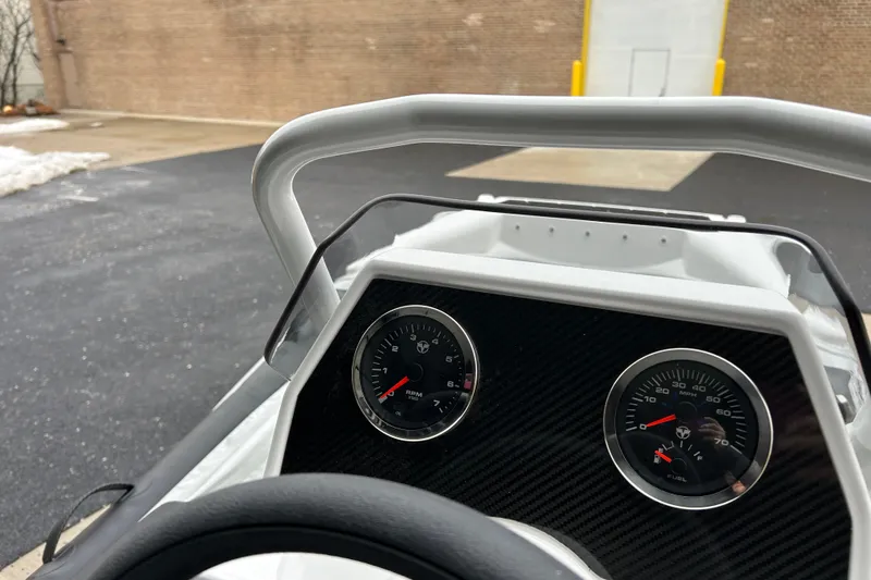 Slide: The Image of 2026 Highfield Sport 360 dashboard with RPM and speed gauges, parked outdoors. - 8