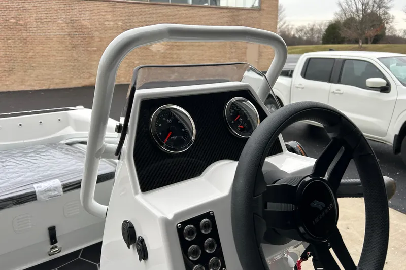 Slide: The Image of 2026 Highfield Sport 360 boat dashboard with steering wheel and gauges. - 9