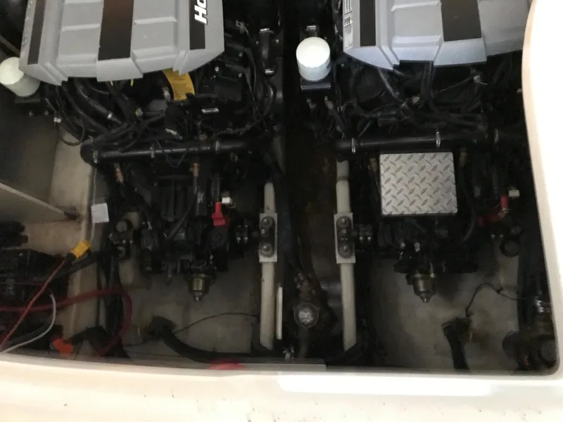 Slide: The Image of Engine compartment of 2008 Sea Ray 330 Sundancer with dual engines. - 13