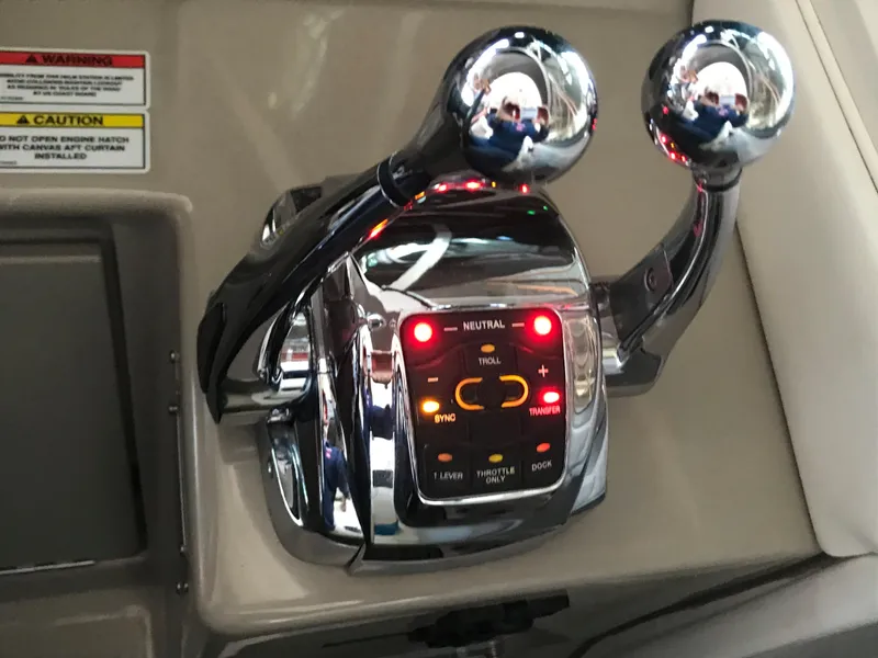 Slide: The Image of Close-up of 2008 Sea Ray 330 Sundancer throttle controls with illuminated indicators. - 19