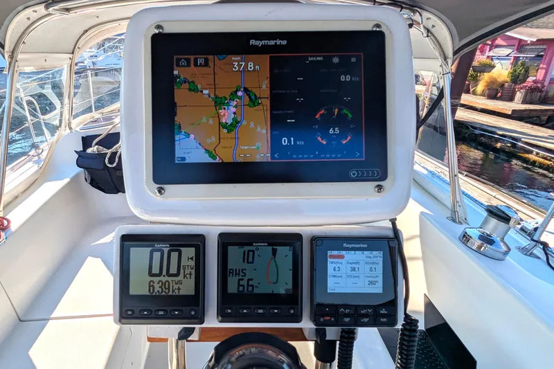 Slide: The Image of Cockpit of 1995 Catalina 36 MkII sailboat with navigation instruments and Raymarine display. - 14