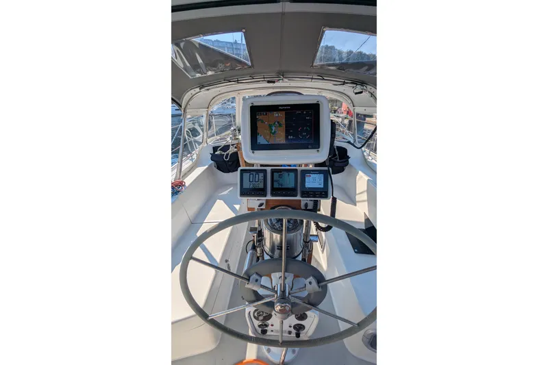 Slide: The Image of Cockpit of 1995 Catalina 36 MkII sailboat with navigation equipment and steering wheel. - 15