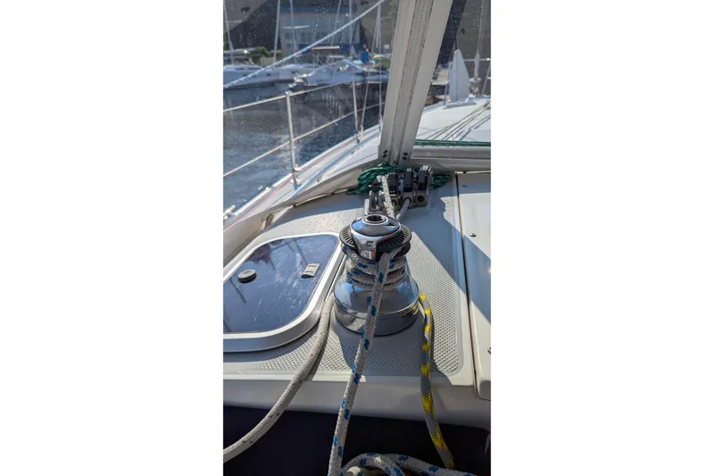 Slide: The Image of Sailboat deck of 1995 Catalina 36 MkII with winch and ropes in marina. - 17