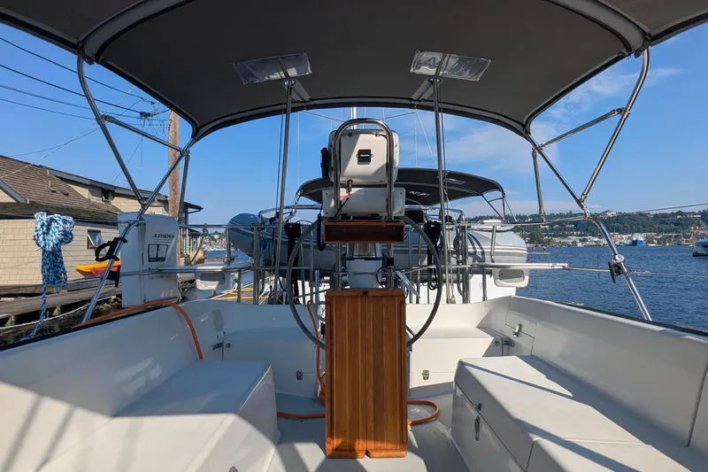 Slide: The Image of Cockpit view of 1995 Catalina 36 MkII sailboat with canopy and scenic waterfront. - 19
