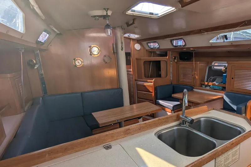 Slide: The Image of Interior of a 1995 Catalina 36 MkII sailboat with wood finish and seating area. - 22