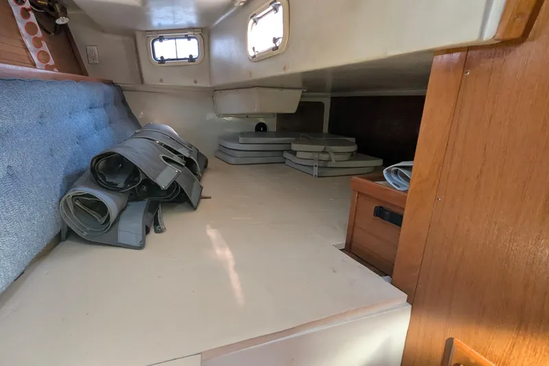 Slide: The Image of Interior cabin of 1995 Catalina 36 MkII sailboat with storage and rolled sails. - 32