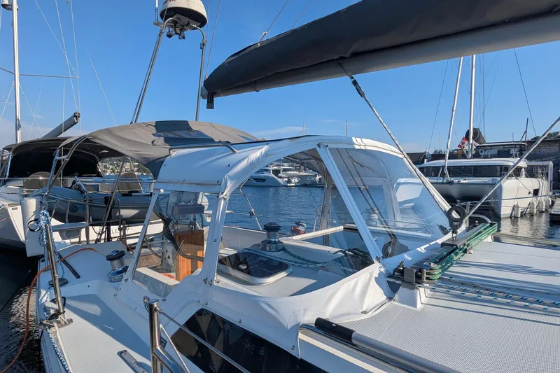 Slide: The Image of 1995 Catalina 36 MkII sailboat docked in a marina under clear blue skies. - 5