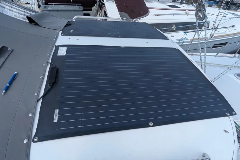 Slide: The Image of Solar panels on a 1995 Catalina 36 MkII sailboat deck, docked in a marina. - 6