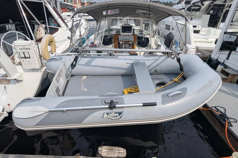 Slide: The Image of Catalina 36 MkII 1995 sailboat with inflatable dinghy docked at marina. - 8