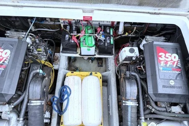 Slide: The Image of Engine compartment of a 1996 Mainship 31 Sedan Bridge with dual 350 EFI engines. - 16