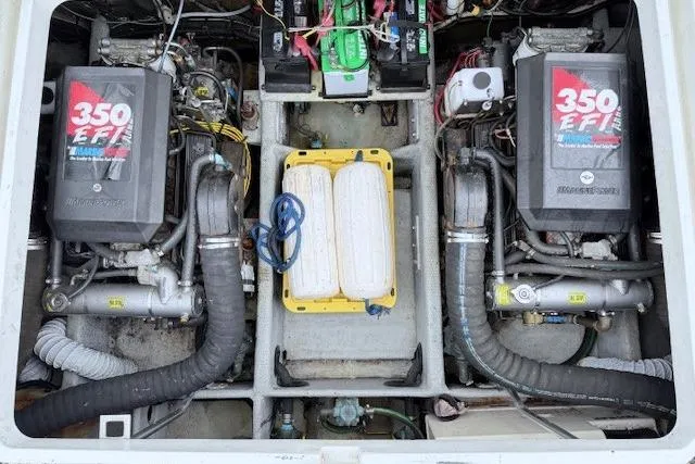Slide: The Image of Engine compartment of a 1996 Mainship 31 Sedan Bridge with twin 350 EFI engines. - 17