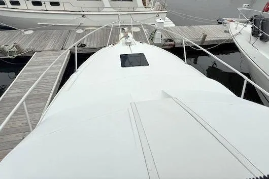 Slide: The Image of 1996 Mainship 31 Sedan Bridge yacht docked at marina, top view. - 7