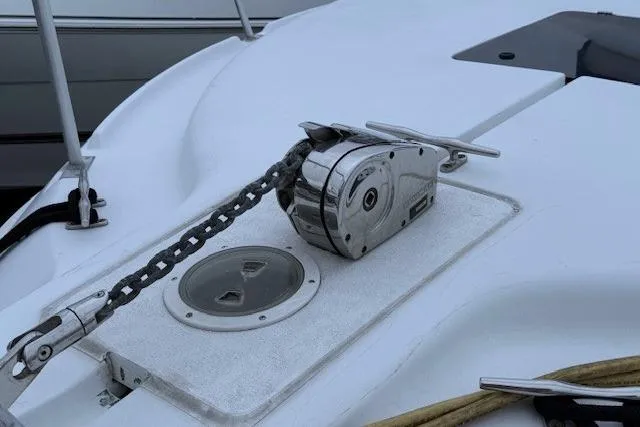 Slide: The Image of 1996 Mainship 31 Sedan Bridge deck with anchor windlass and chain. - 8