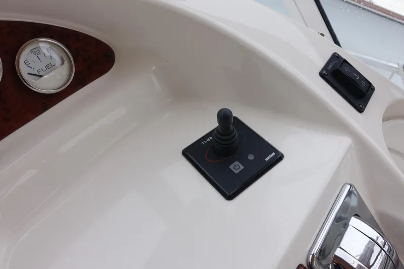 Slide: The Image of 2001 Silverton 410 Sport Bridge dashboard with fuel gauge and control panel. - 11