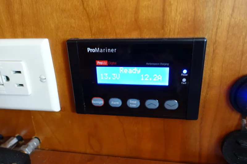 Slide: The Image of ProMariner digital display on 2001 Silverton 410 Sport Bridge, showing voltage and current. - 33