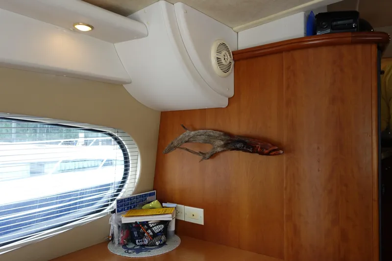 Slide: The Image of Interior of 2001 Silverton 410 Sport Bridge with wood paneling and window view. - 40