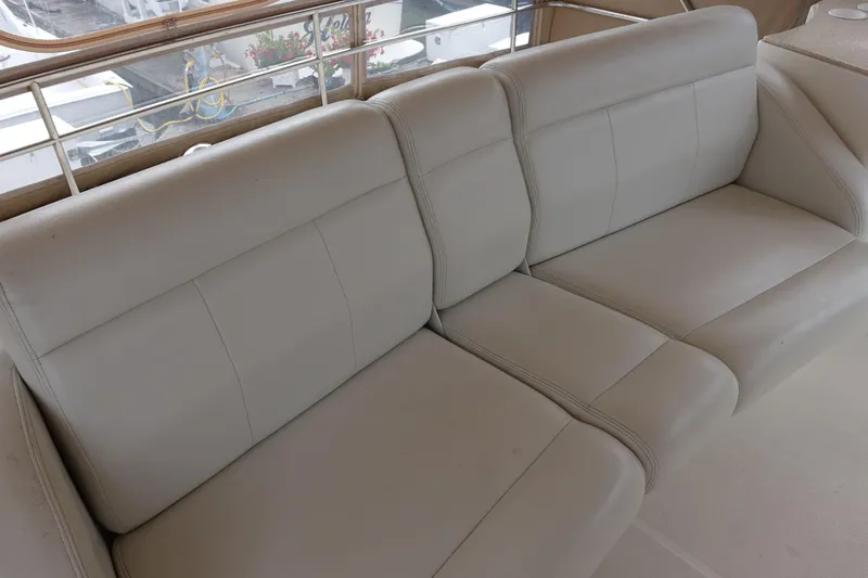 Slide: The Image of 2001 Silverton 410 Sport Bridge interior with beige leather seating. - 9