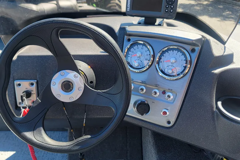 Slide: The Image of 2022 Tracker Pro Guide V-16 SC dashboard with steering wheel and gauges. - 3