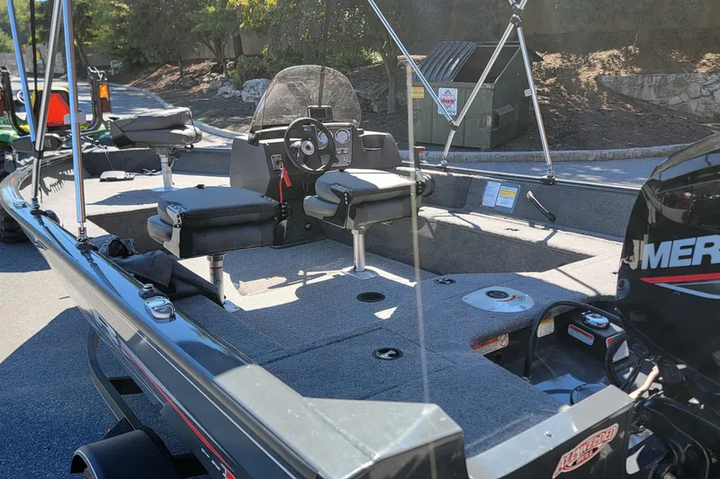 Slide: The Image of 2022 Tracker Pro Guide V-16 SC fishing boat interior with seating and controls. - 4