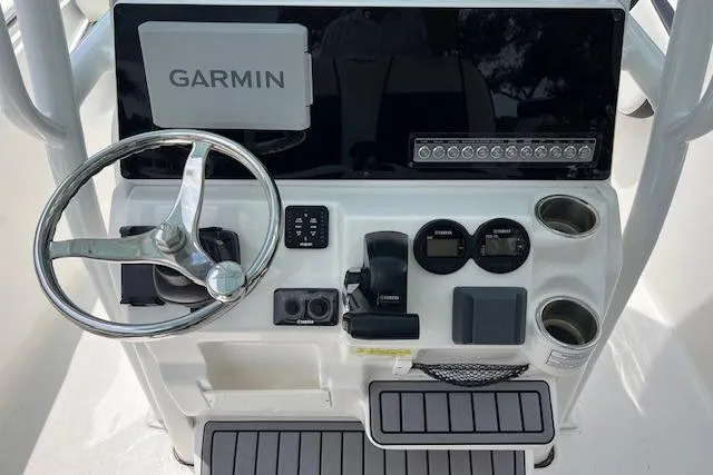 Slide: The Image of Helm of 2023 Tidewater 220 CC Adventure boat with Garmin navigation system. - 5