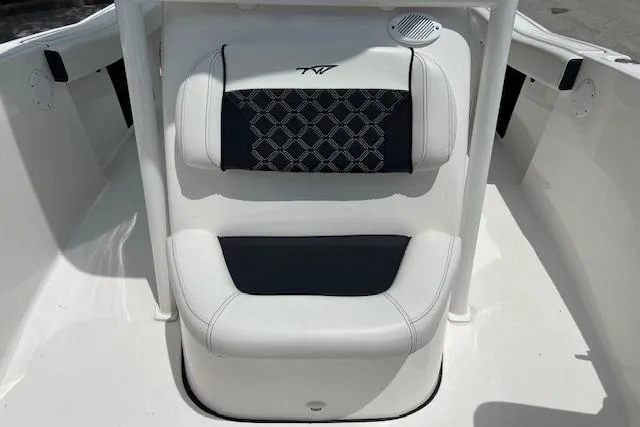 Slide: The Image of 2023 Tidewater 220 CC Adventure boat seating with stylish black and white upholstery. - 9