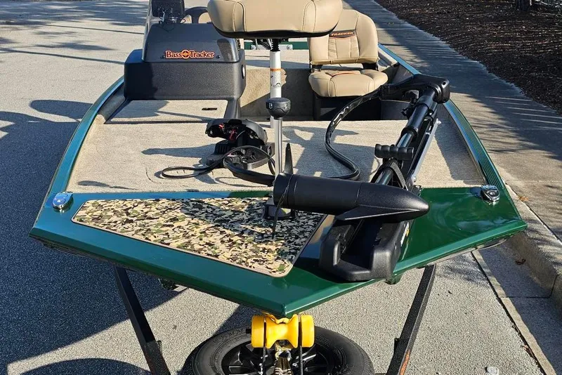 Slide: The Image of 2026 Tracker Bass Tracker Classic Limited boat with camouflage deck and seating. - 5