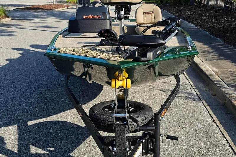 Slide: The Image of 2026 Tracker Bass Tracker Classic Limited boat on trailer, parked on a sunny street. - 6