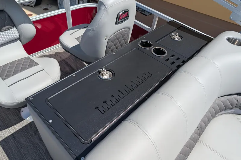 Slide: The Image of 2025 Ranger Reata 220FC boat interior with seating and utility console. - 11