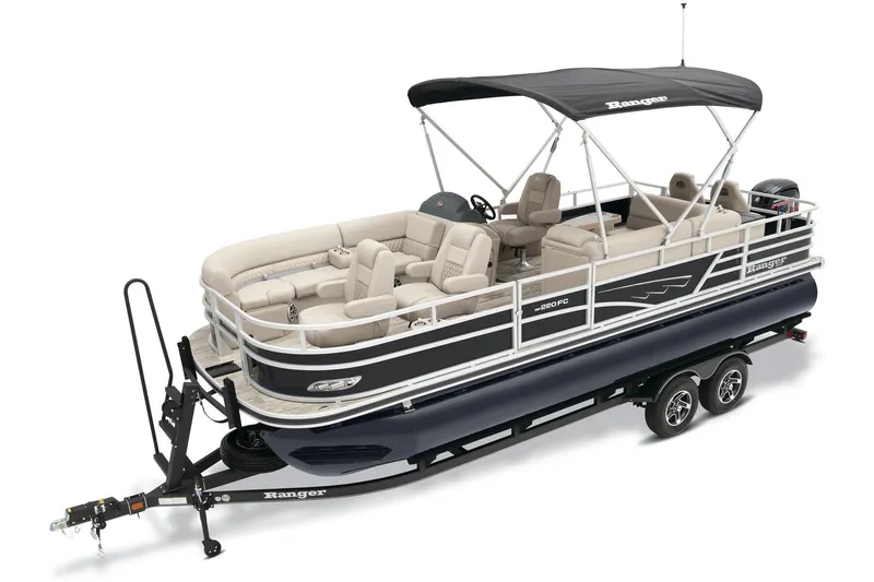 Slide: The Image of 2025 Ranger Reata 220FC boat interior with gray seating and steering wheel. - 3