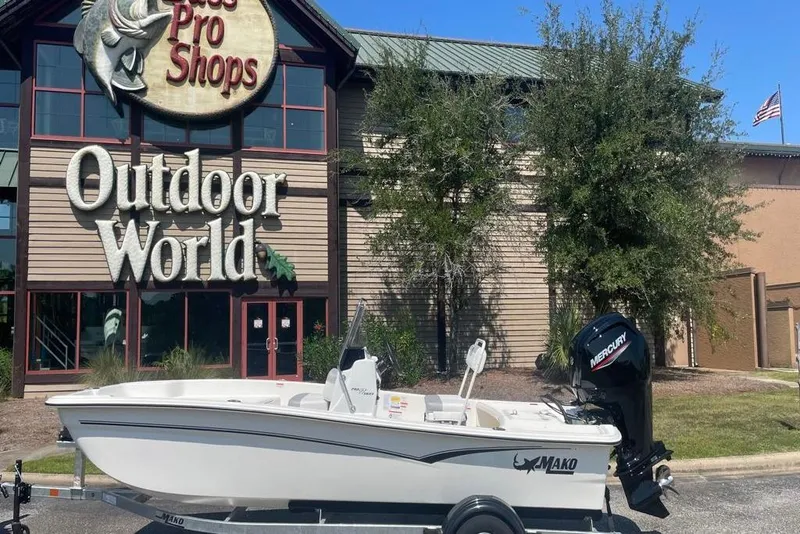 Slide: The Image of 2026 Mako Pro Skiff 17 CC boat outside Bass Pro Shops Outdoor World. - 5