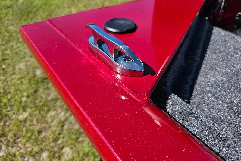 Slide: The Image of 2026 Tracker Pro 170 boat detail with red finish and cleat on deck. - 18