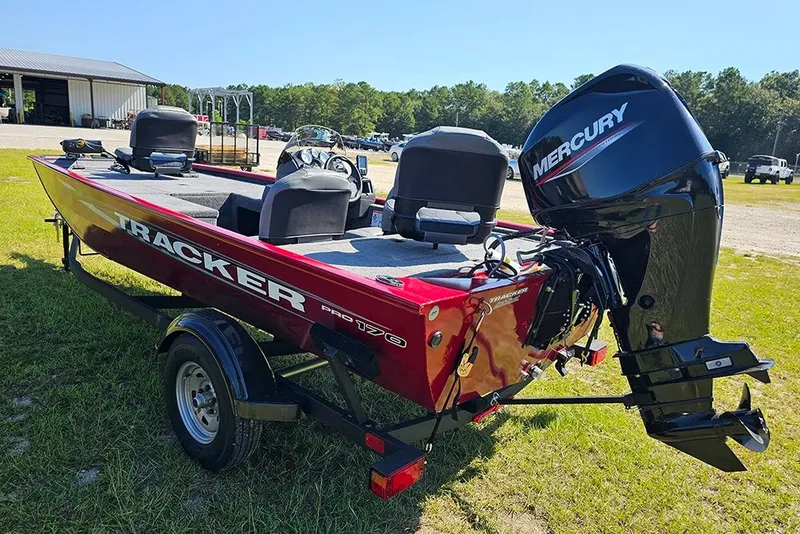 Slide: The Image of 2026 Tracker Pro 170 boat with Mercury engine on grassy area. - 6