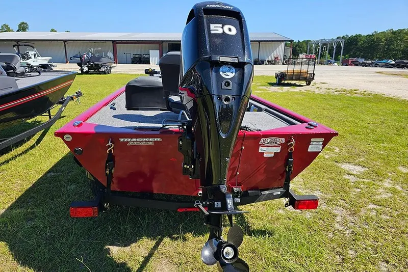Slide: The Image of 2026 Tracker Pro 170 boat with Mercury 50 engine, parked on grass. - 7
