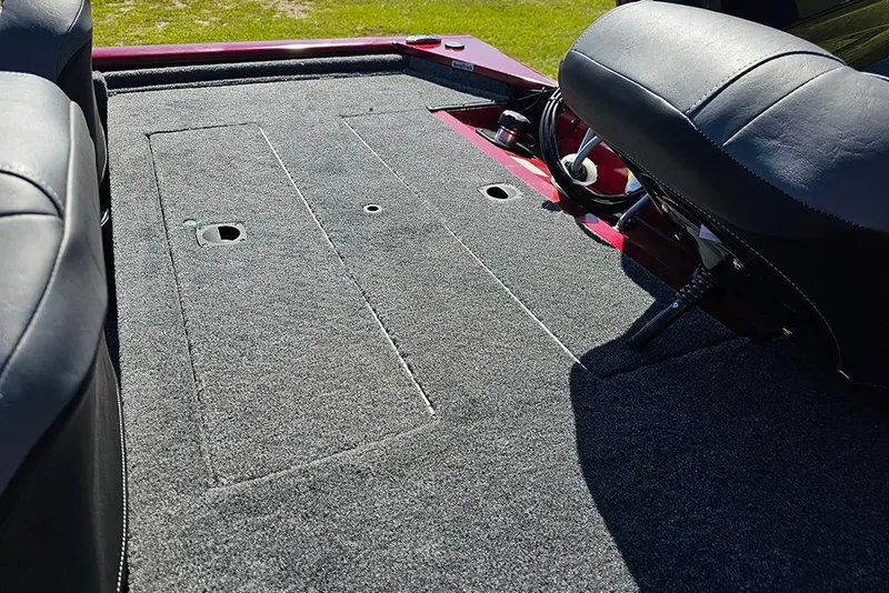 Slide: The Image of 2026 Tracker Pro 170 boat interior with carpeted deck and seating. - 8