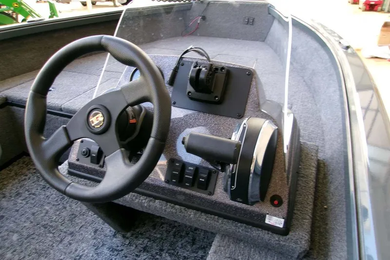 Slide: The Image of 2025 Ranger VS1665SC boat console with steering wheel and controls. - 5