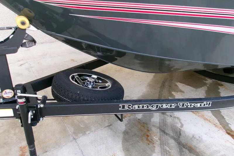 Slide: The Image of 2025 Ranger VS1665SC boat on Ranger Trail trailer with spare tire. - 2