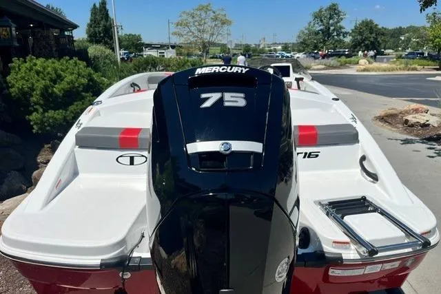 Slide: The Image of 2026 Tahoe T16 boat with Mercury 75 engine, parked outdoors on a sunny day. - 67