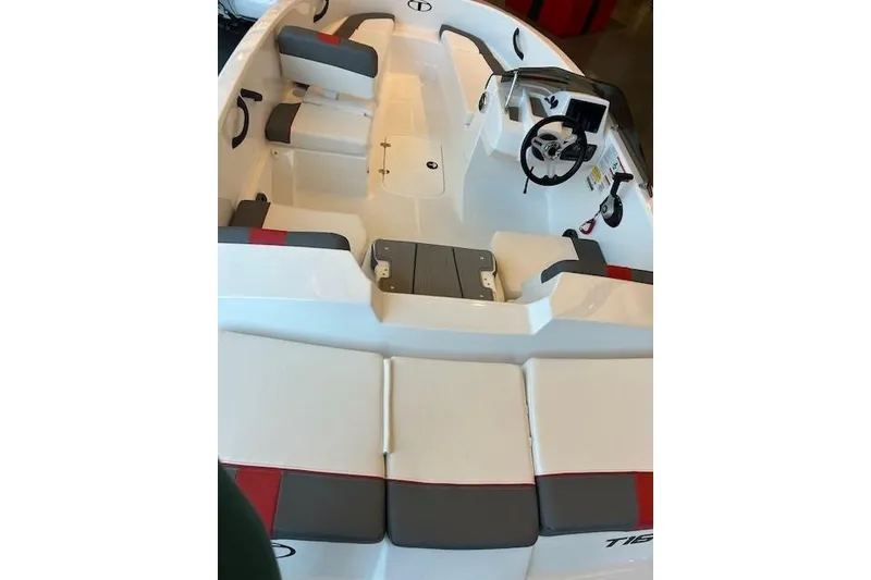 Slide: The Image of 2026 Tahoe T16 boat interior with seating and steering wheel, featuring modern design elements. - 59