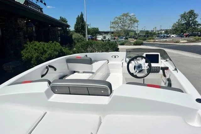 Slide: The Image of 2026 Tahoe T16 boat with sleek interior design and modern steering console. - 65