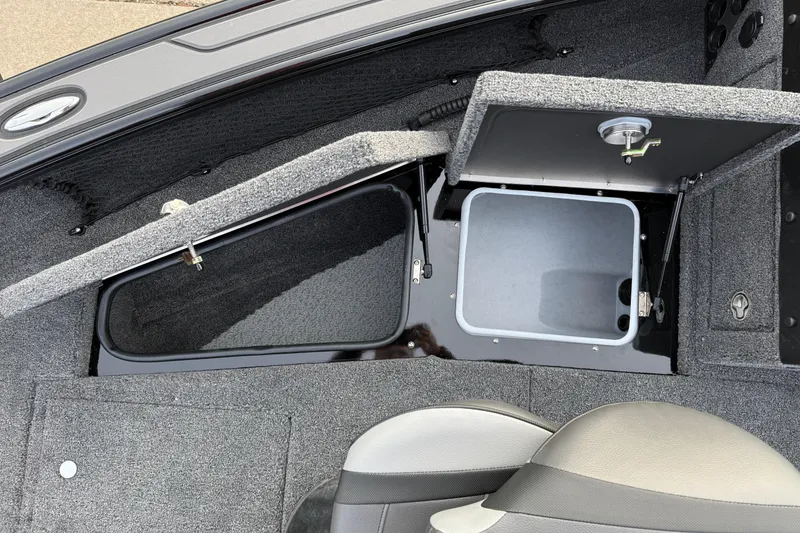 Slide: The Image of Interior view of 2026 Lund 1975 Pro-V Sport boat storage compartments. - 12