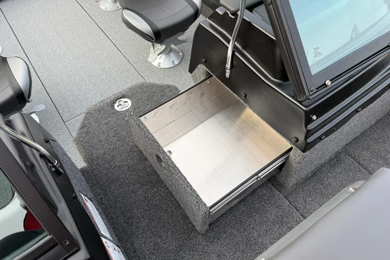 Slide: The Image of 2026 Lund 1975 Pro-V Sport boat interior with open storage compartment and seating. - 15