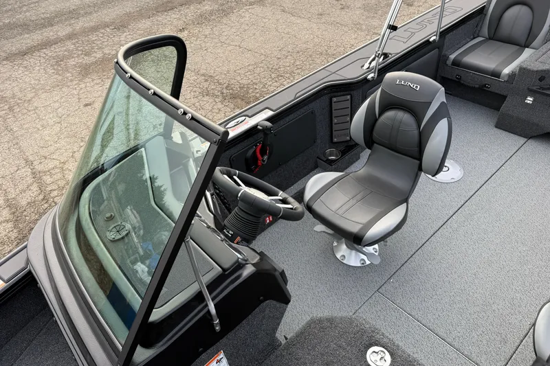 Slide: The Image of 2026 Lund 1975 Pro-V Sport boat interior with sleek seating and modern design. - 17